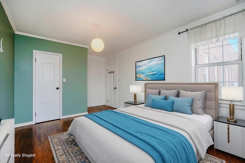 6665 Colonial Road, Unit 6E Brooklyn, NY 11220 - Photo 14 of 22 a bedroom with a large bed and a window