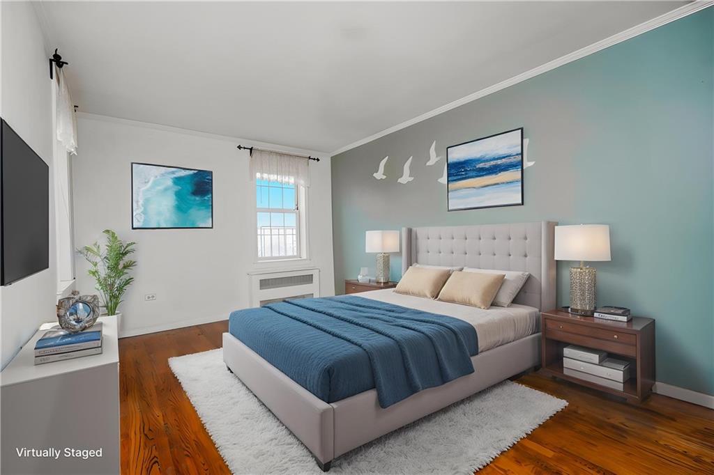 6665 Colonial Road, Unit 6E Brooklyn, NY 11220 - Photo 16 of 22 a bedroom with a large bed and a couch