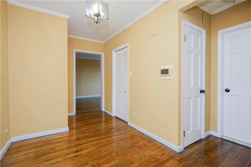 6665 Colonial Road, Unit 6E Brooklyn, NY 11220 - Photo 3 of 22 a view of a hallway with wooden floor