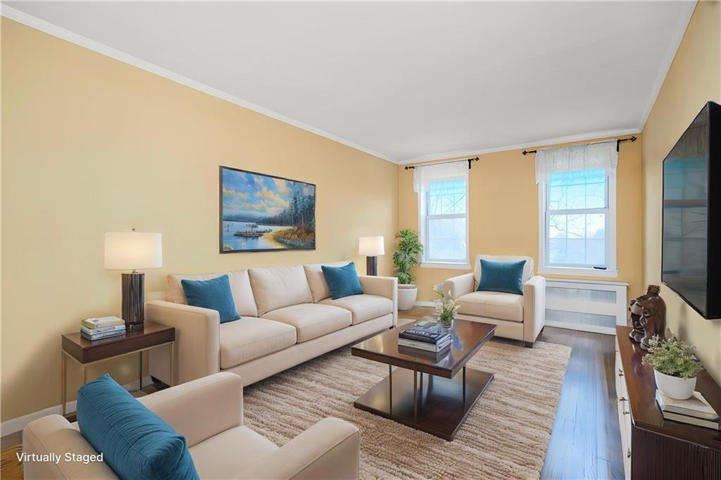 6665 Colonial Road, Unit 6E Brooklyn, NY 11220 - Photo 8 of 22 a living room with furniture and a large window