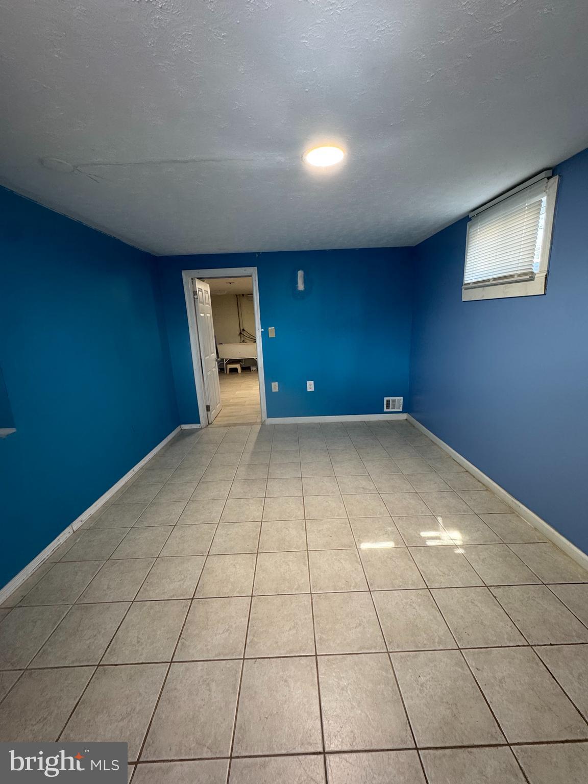 9604 Lanham Severn Road Lanham, MD 20706 - Photo 14 of 30 a view of a livingroom with an empty space and window