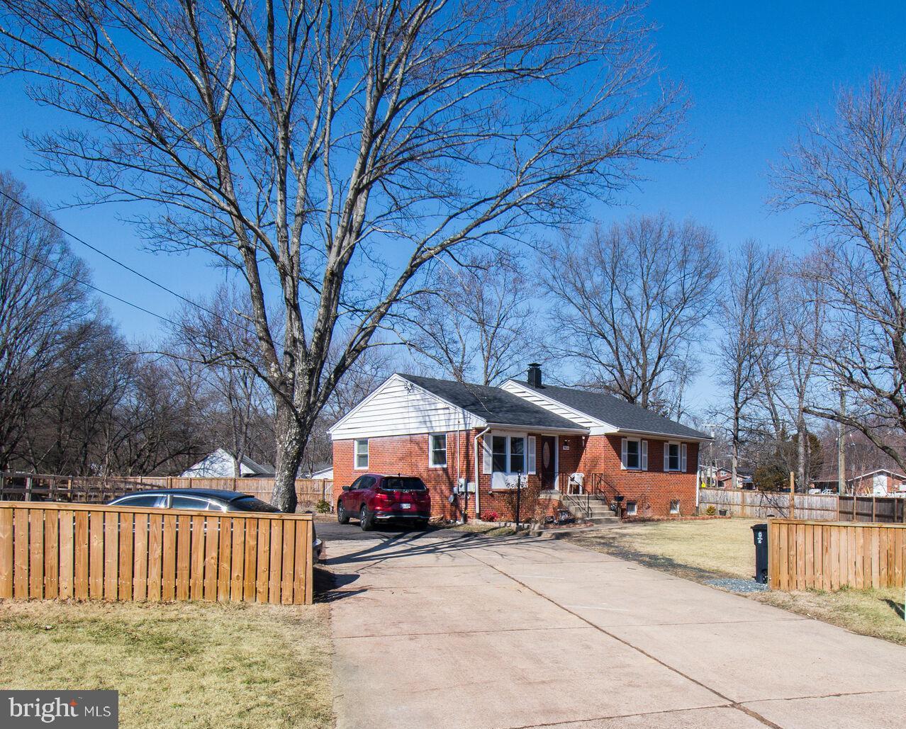 9604 Lanham Severn Road Lanham, MD 20706 - Photo 2 of 30 a view of a town with large trees