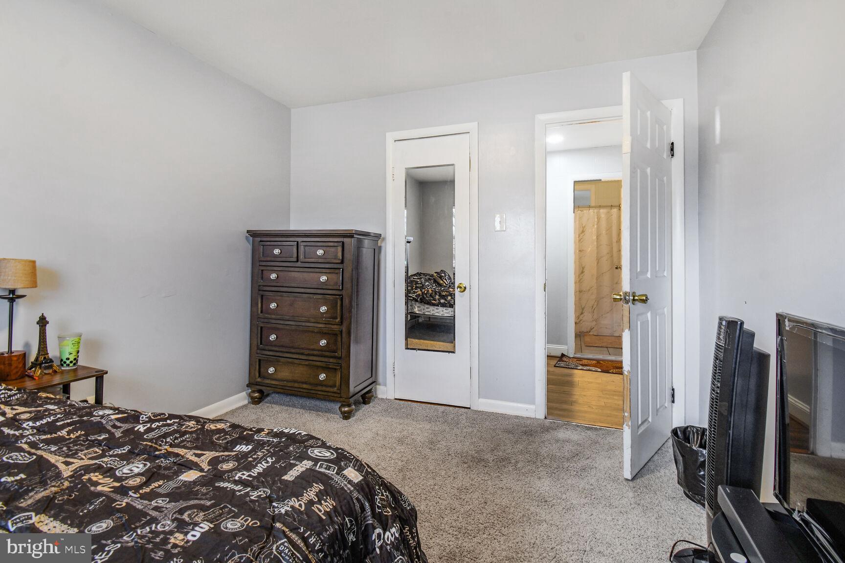 9604 Lanham Severn Road Lanham, MD 20706 - Photo 25 of 30 a bedroom with a bed and furniture