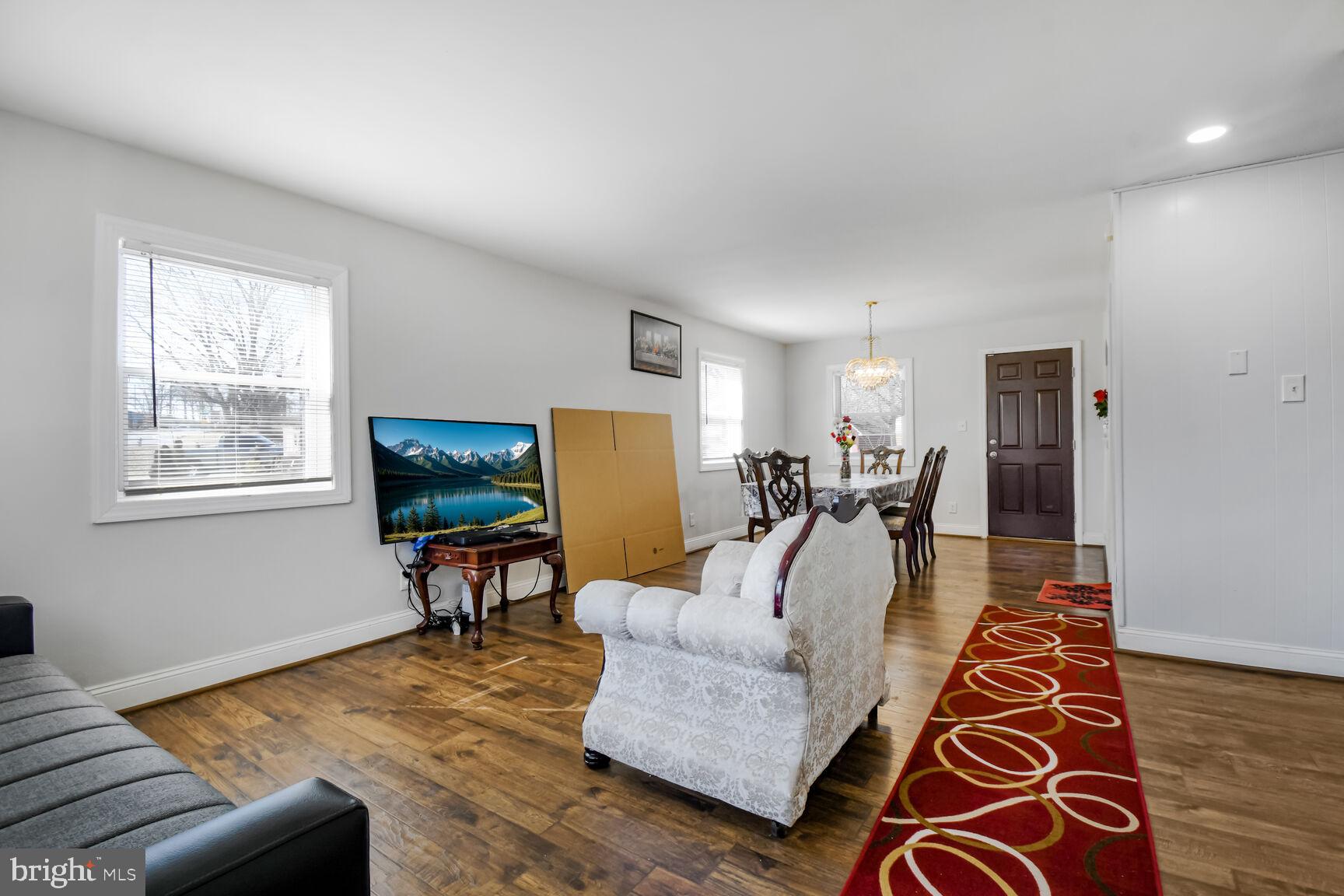 9604 Lanham Severn Road Lanham, MD 20706 - Photo 4 of 30 a living room with furniture and a flat screen tv