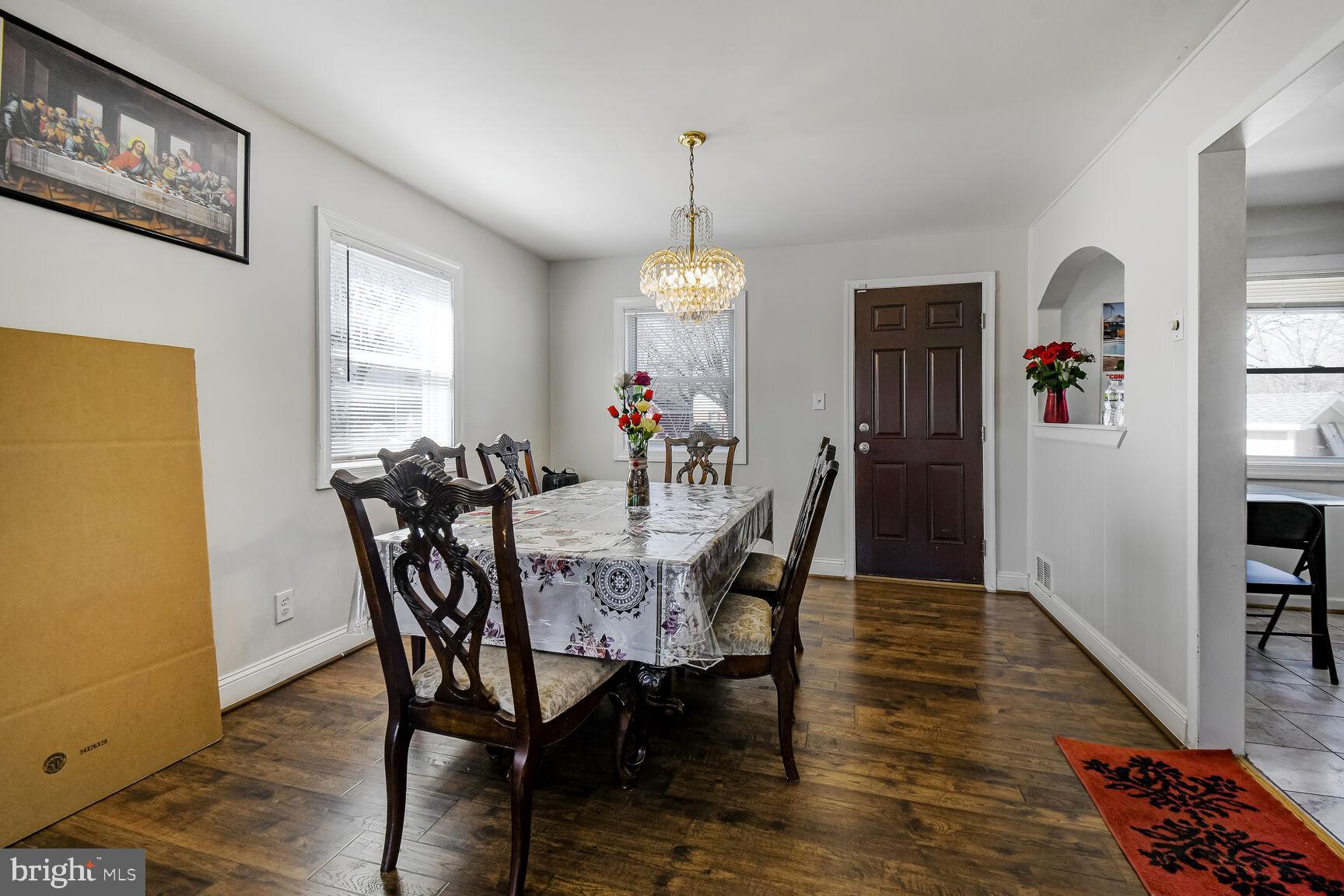 9604 Lanham Severn Road Lanham, MD 20706 - Photo 6 of 30 a view of a a dining room with furniture window and wooden floor