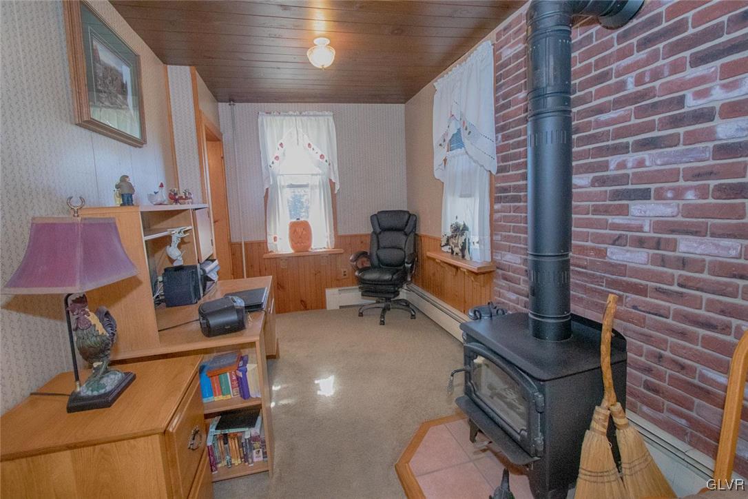 234 Walker Road Macungie, PA 18062 - Photo 6 of 15 Living room area with wood fireplace insert.