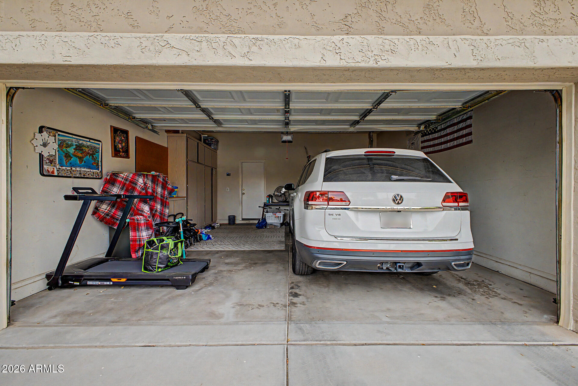 4272 East Buckboard Road Gilbert, AZ 85297 - Photo 32 of 37 a car and bike in garage