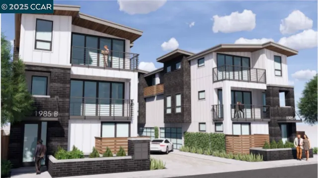 a front view of a residential apartment building with a yard