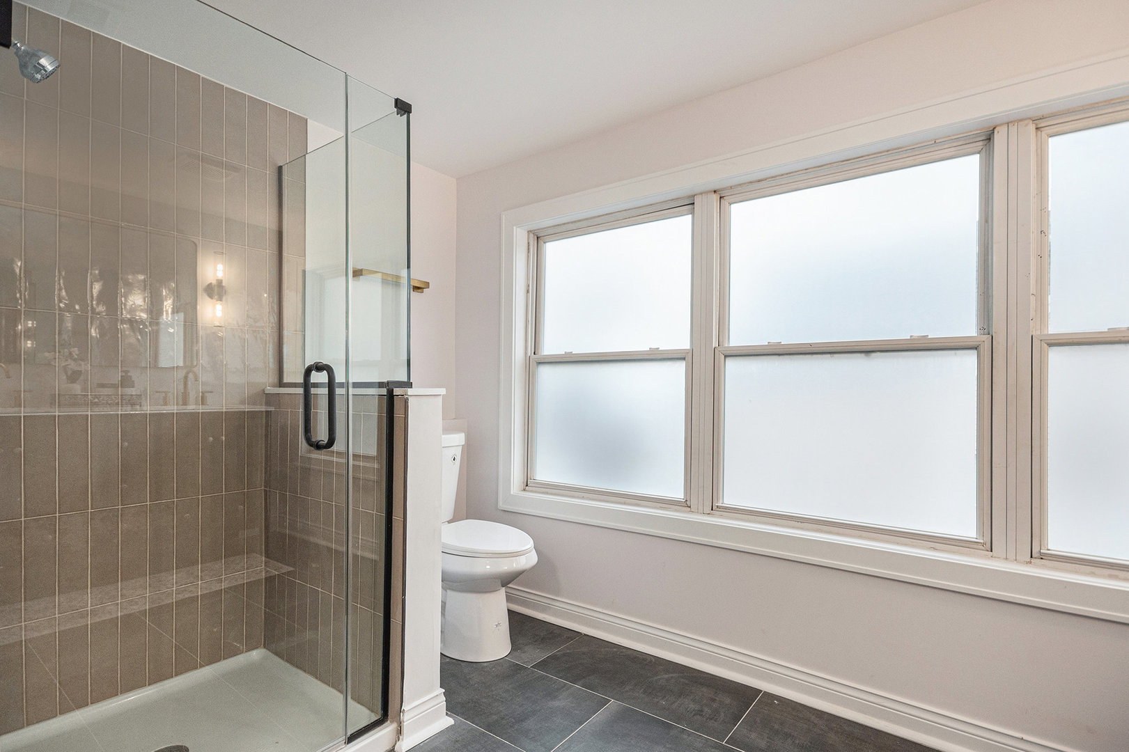 4138 Arthur Avenue Brookfield, IL 60513 - Photo 17 of 25 a bathroom with a toilet and a shower