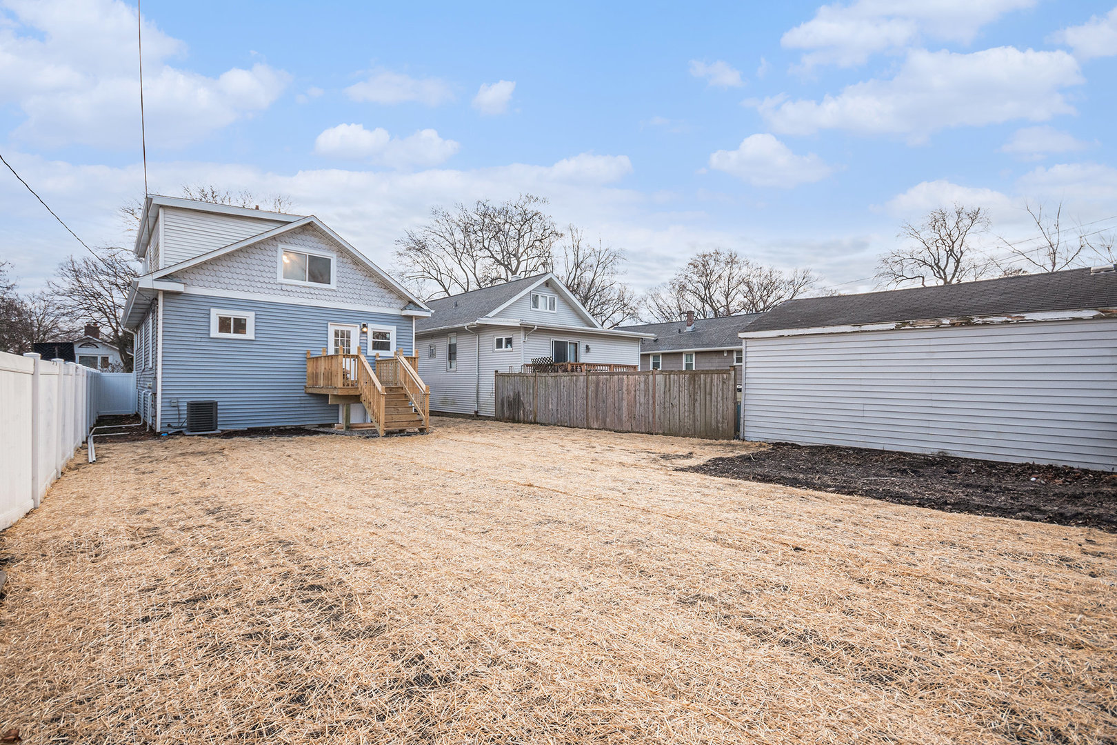 4138 Arthur Avenue Brookfield, IL 60513 - Photo 23 of 25 a view of a blue house with a wooden fence