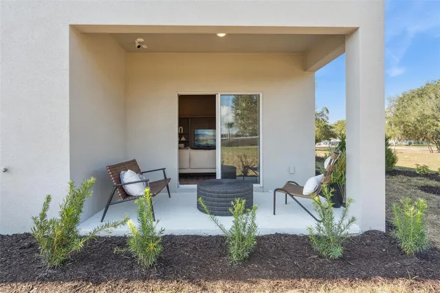 a view of a house with outdoor seating space