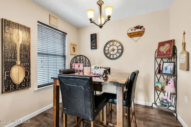 a view of a dining area with furniture and a clock