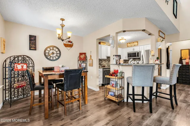 a kitchen with stainless steel appliances a refrigerator stove and microwave