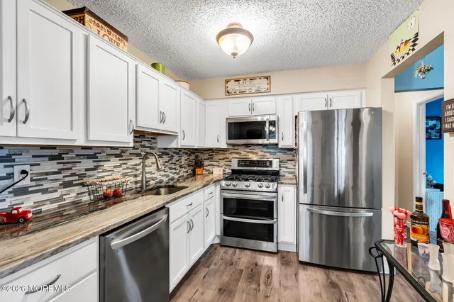 a view of a living room and dining room