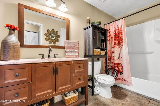 a bed room with a bed and a lamp