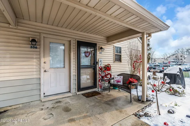 a bathroom with a sink mirror and toilet