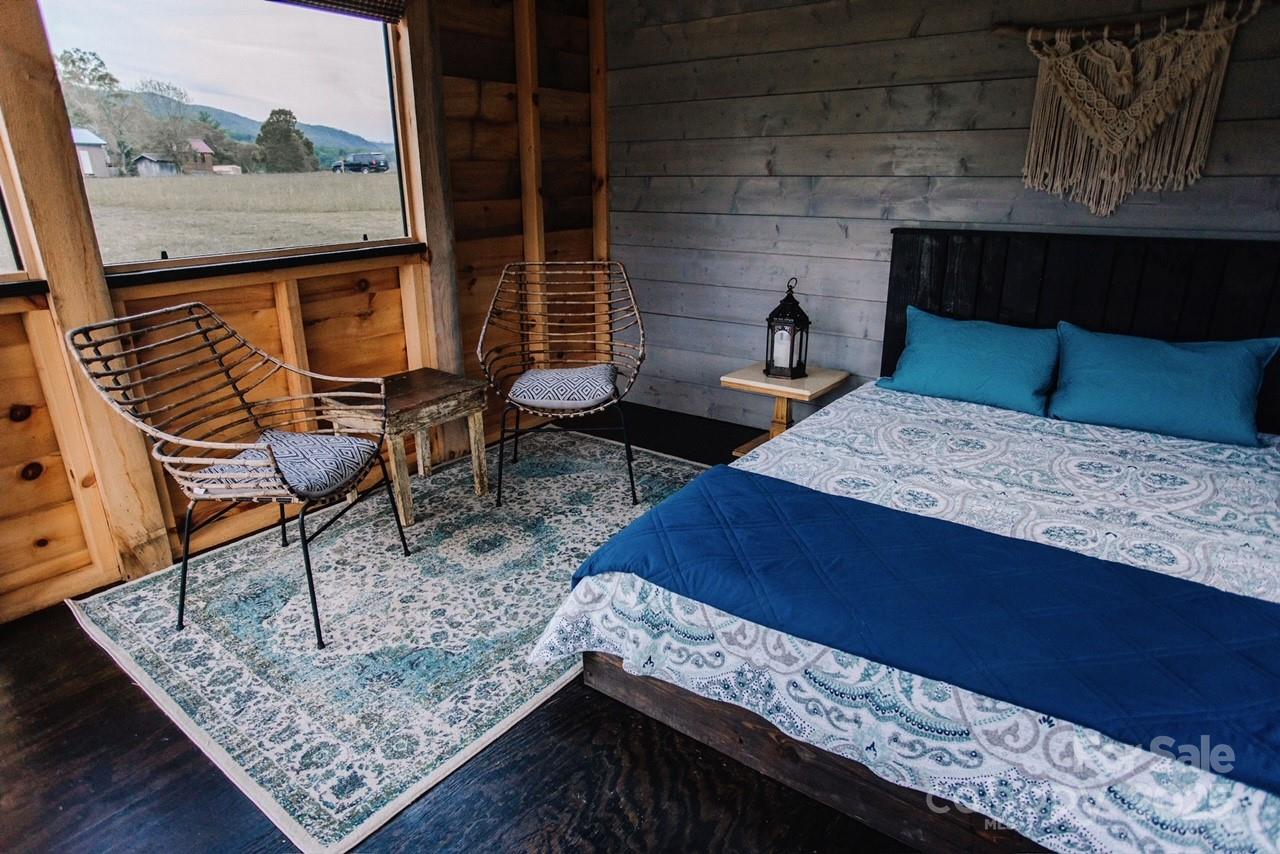 1295 Paint Rock Road Hot Springs, NC 28743 - Photo 12 of 29 a living room with chairs and a rug