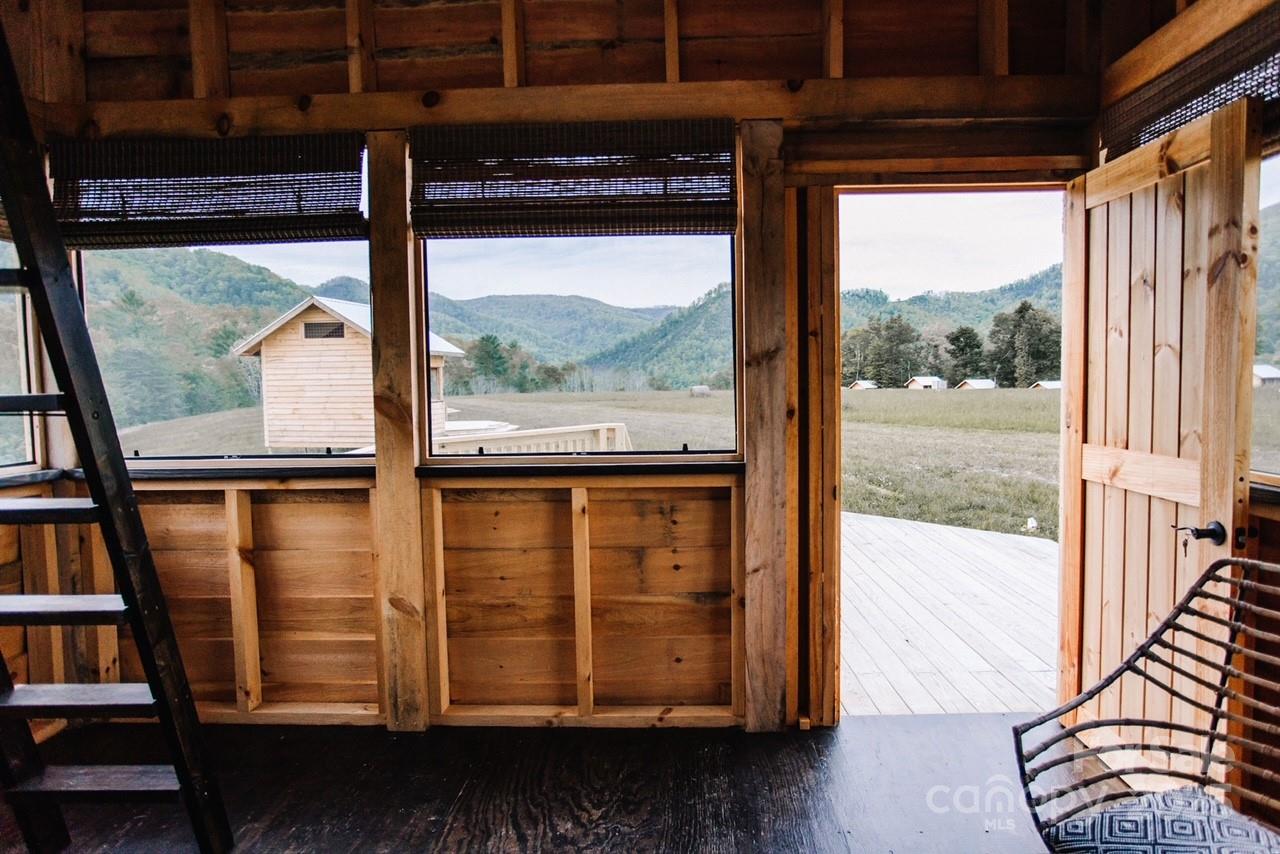 1295 Paint Rock Road Hot Springs, NC 28743 - Photo 13 of 29 a view of a large window with wooden floor