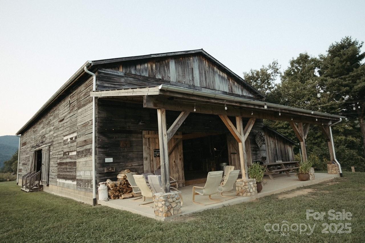 1295 Paint Rock Road Hot Springs, NC 28743 - Photo 23 of 29 a view of a chair and table in front of house