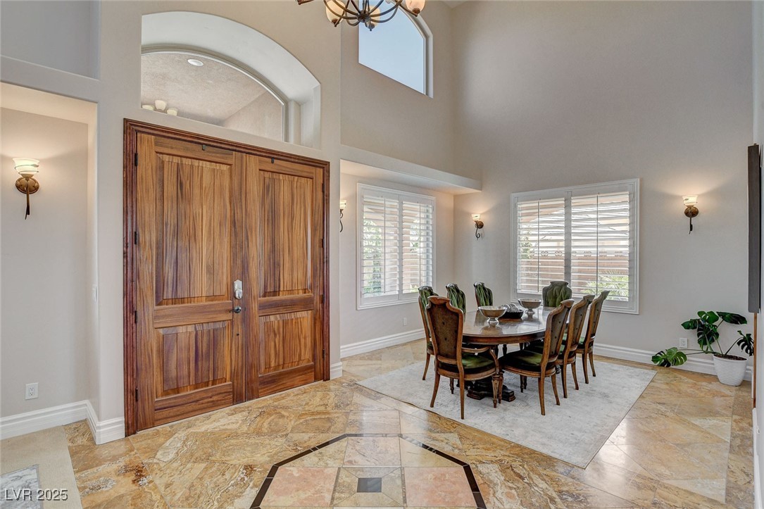 1182 Thomas Bay Circle Logandale, NV 89021 - Photo 17 of 98 Stunning chandelier, solid double doors and gorgeous tile flooring