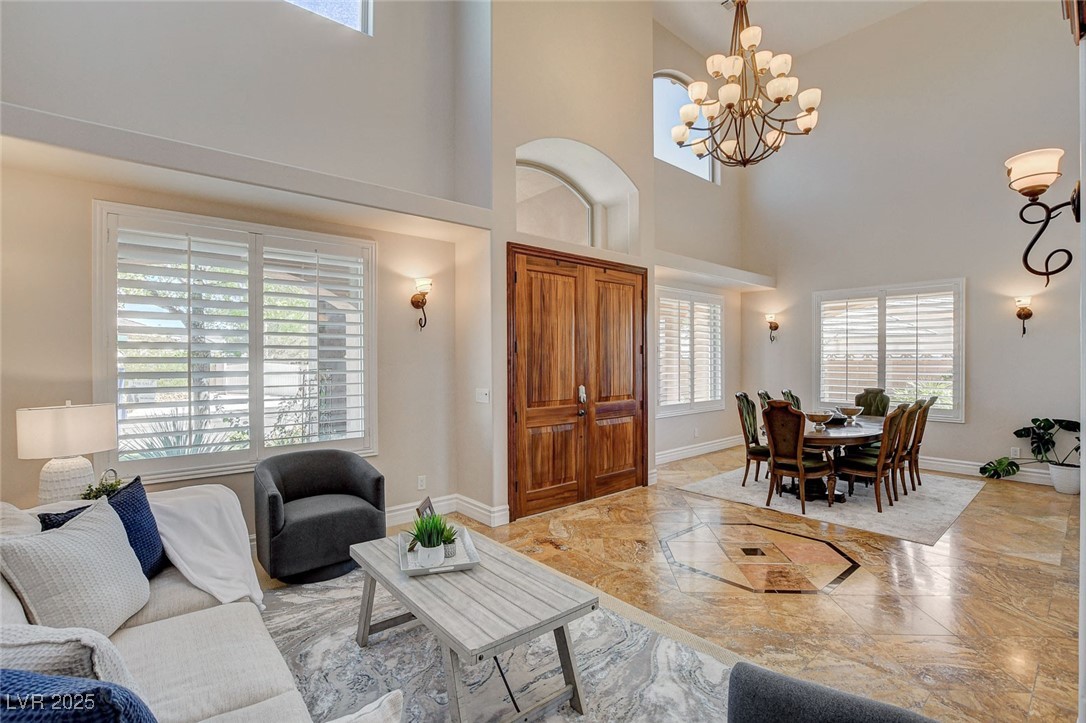 1182 Thomas Bay Circle Logandale, NV 89021 - Photo 19 of 98 Living area with a high ceiling, a chandelier