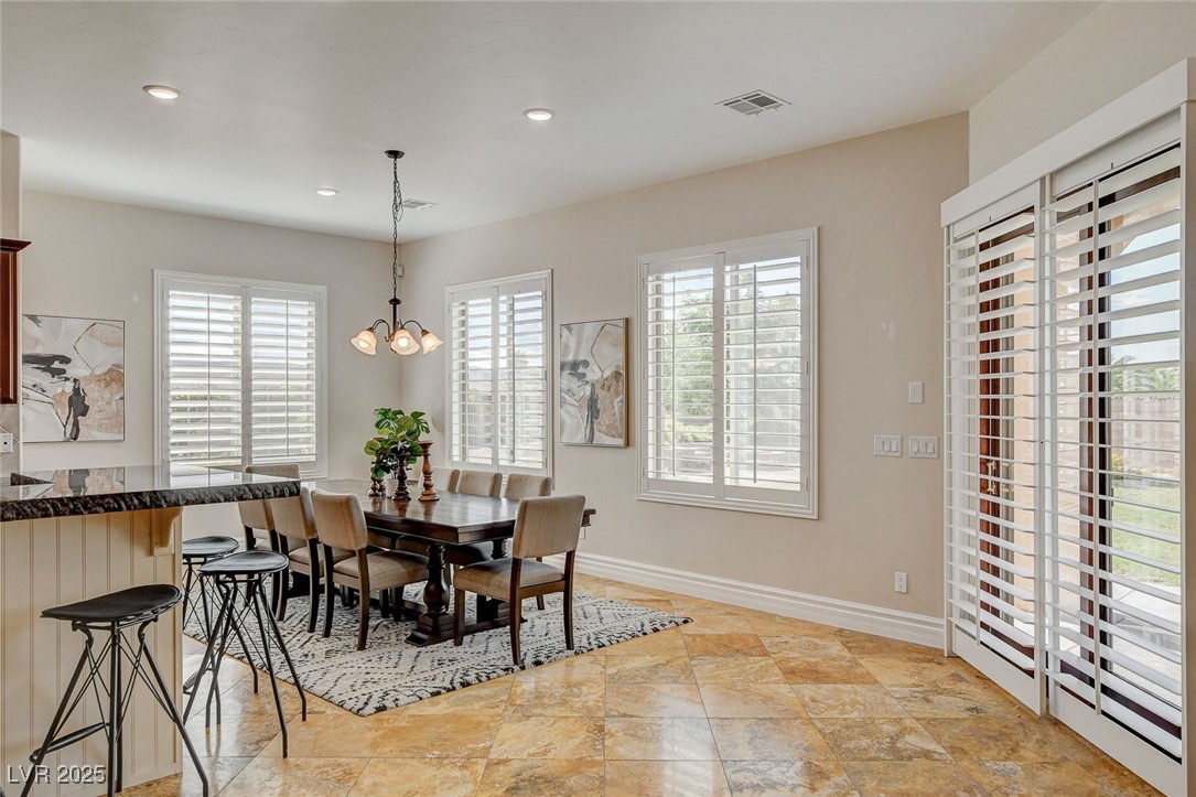 1182 Thomas Bay Circle Logandale, NV 89021 - Photo 23 of 98 Dining area featuring plenty of natural light, a chandelier, and recessed lighting
