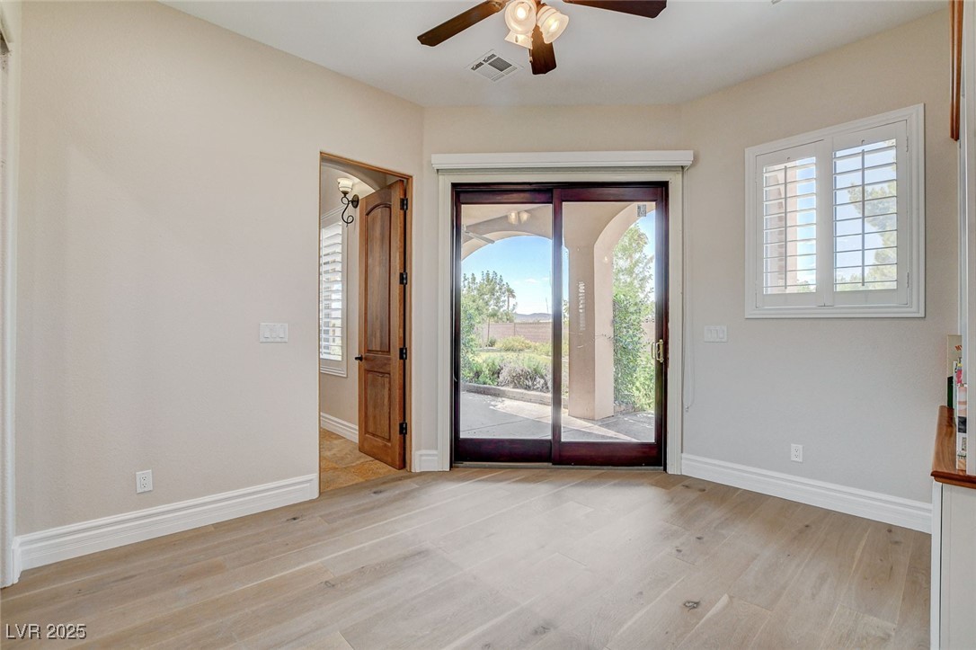 1182 Thomas Bay Circle Logandale, NV 89021 - Photo 41 of 98 Foyer entrance with a ceiling fan, light wood-type flooring, and healthy amount of natural light