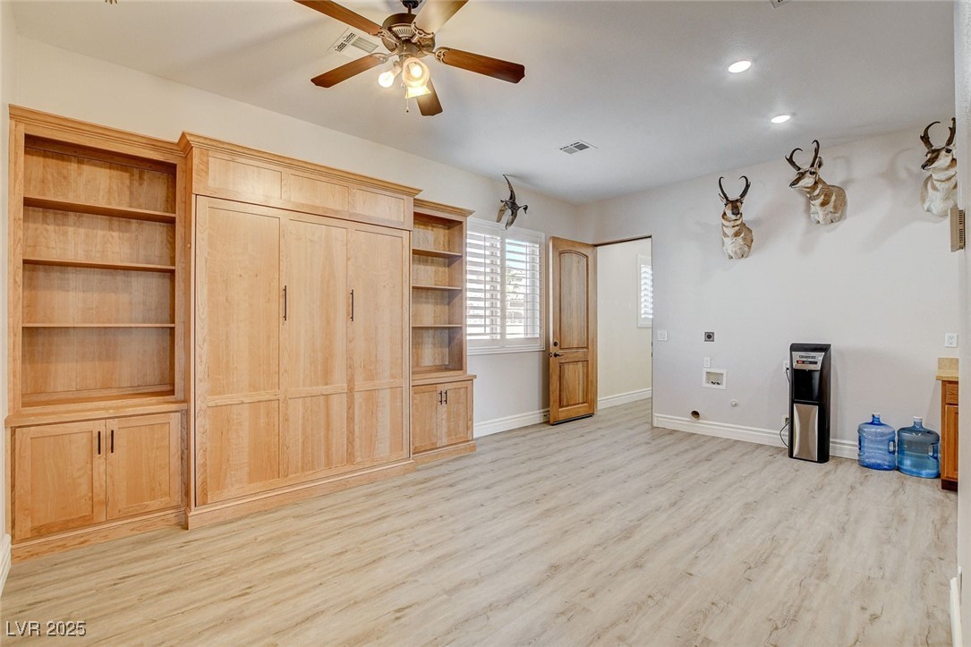 1182 Thomas Bay Circle Logandale, NV 89021 - Photo 42 of 98 Perfect for multigenerational living! This bedroom or living room with Murphy bed features light wood-style flooring, ceiling fan, and recessed lighting