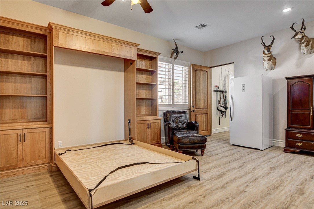 1182 Thomas Bay Circle Logandale, NV 89021 - Photo 43 of 98 Bedroom featuring light wood-type flooring, and ceiling fan