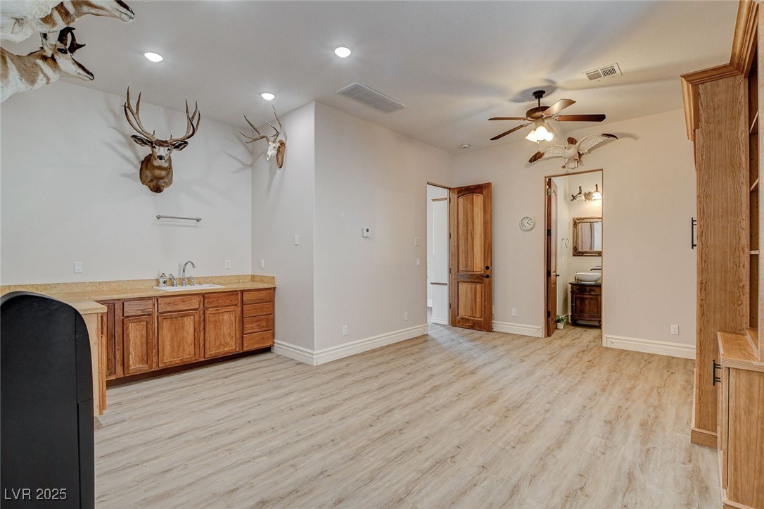 1182 Thomas Bay Circle Logandale, NV 89021 - Photo 45 of 98 View towards kitchenette with hook up for dryer, washer and fridge