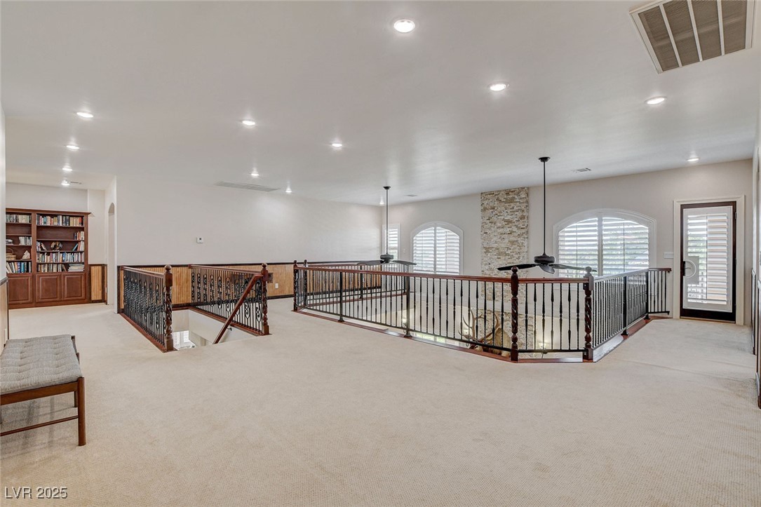 1182 Thomas Bay Circle Logandale, NV 89021 - Photo 51 of 98 Loft of game room with carpet, an upstairs landing, and recessed lighting