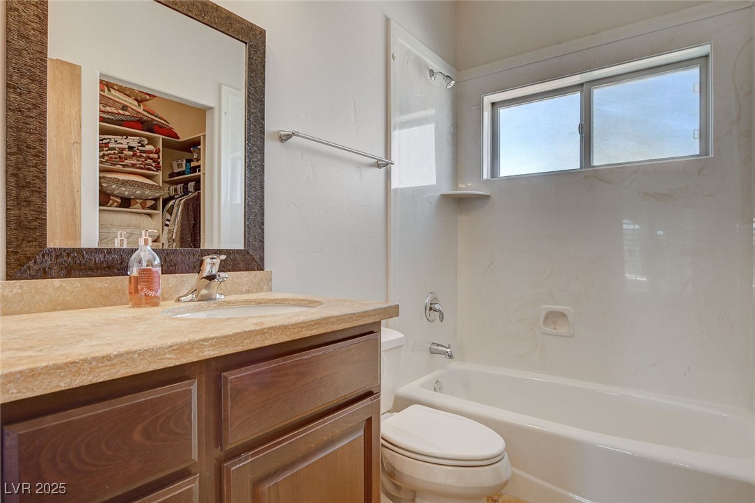 1182 Thomas Bay Circle Logandale, NV 89021 - Photo 57 of 98 Full ensuite bath featuring vanity, shower / bathtub combination, and a spacious closet