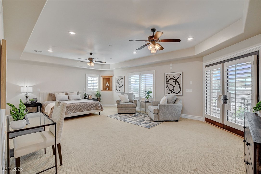 1182 Thomas Bay Circle Logandale, NV 89021 - Photo 64 of 98 Carpeted bedroom with a raised ceiling, access to exterior, a ceiling fan, and recessed lighting