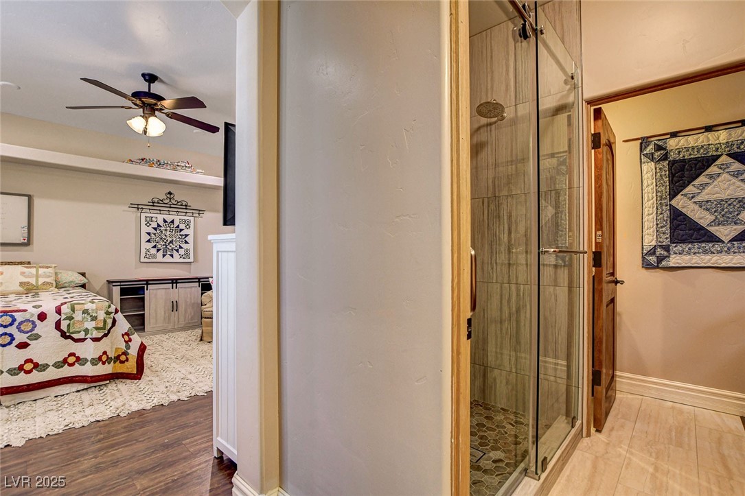 1182 Thomas Bay Circle Logandale, NV 89021 - Photo 78 of 98 Full bathroom featuring ceiling fan, a remodeled stall shower, and ensuite bathroom