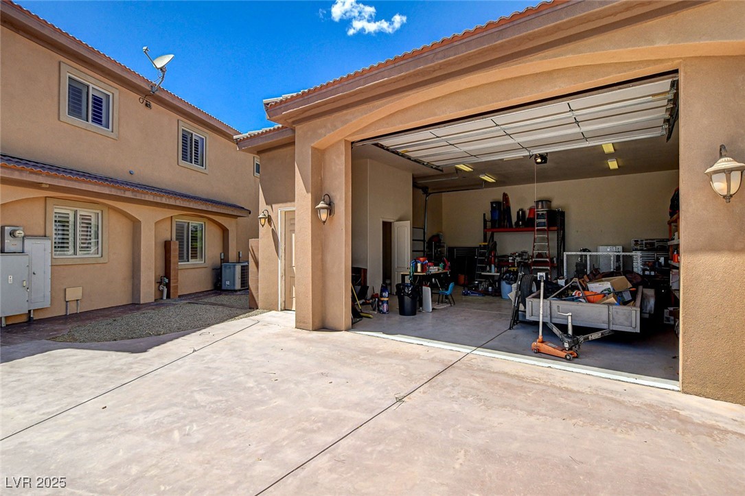 1182 Thomas Bay Circle Logandale, NV 89021 - Photo 84 of 98 Garage featuring concrete driveway