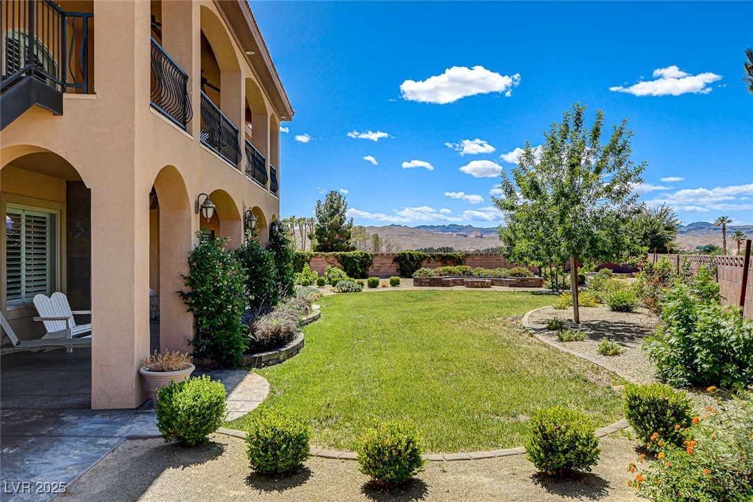 1182 Thomas Bay Circle Logandale, NV 89021 - Photo 85 of 98 View of yard with a mountain view and a balcony