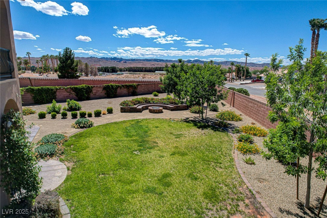 1182 Thomas Bay Circle Logandale, NV 89021 - Photo 95 of 98 Fenced backyard featuring a mesa view and a patio