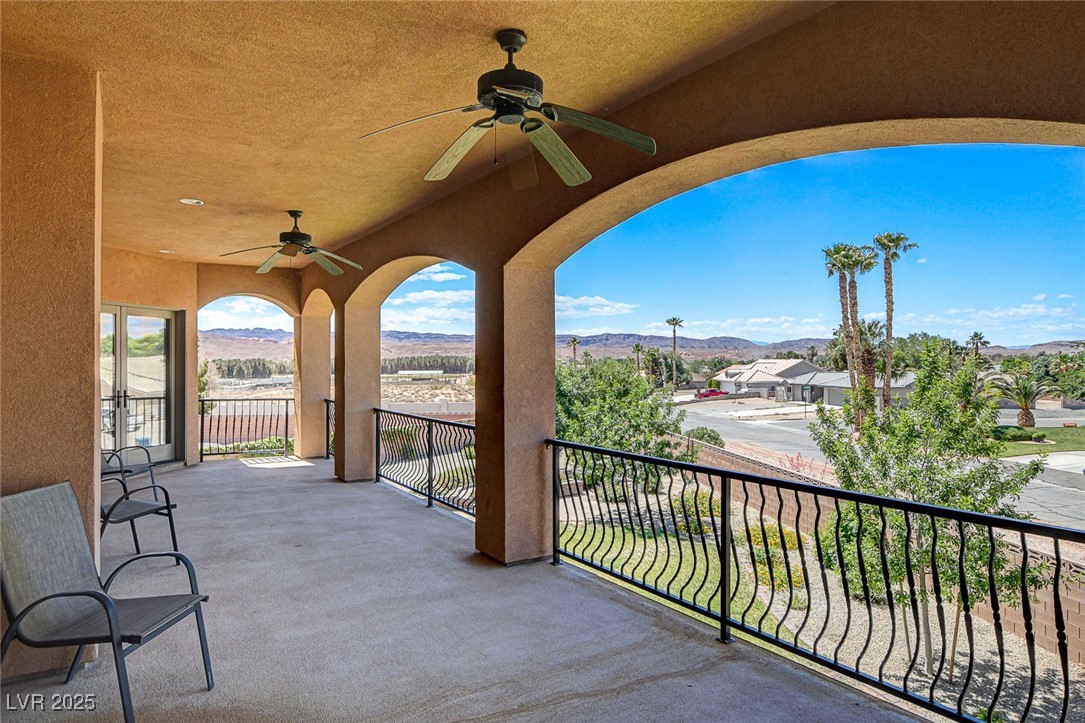 1182 Thomas Bay Circle Logandale, NV 89021 - Photo 98 of 98 Patio / terrace with ceiling fan and a mesa view