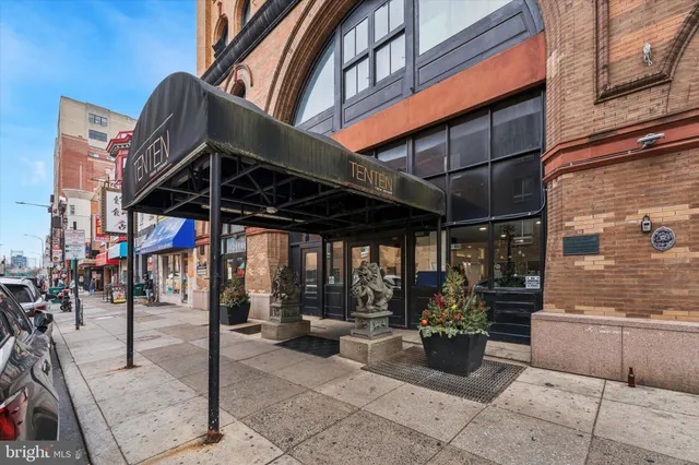 a view of path along with retail shop and buildings