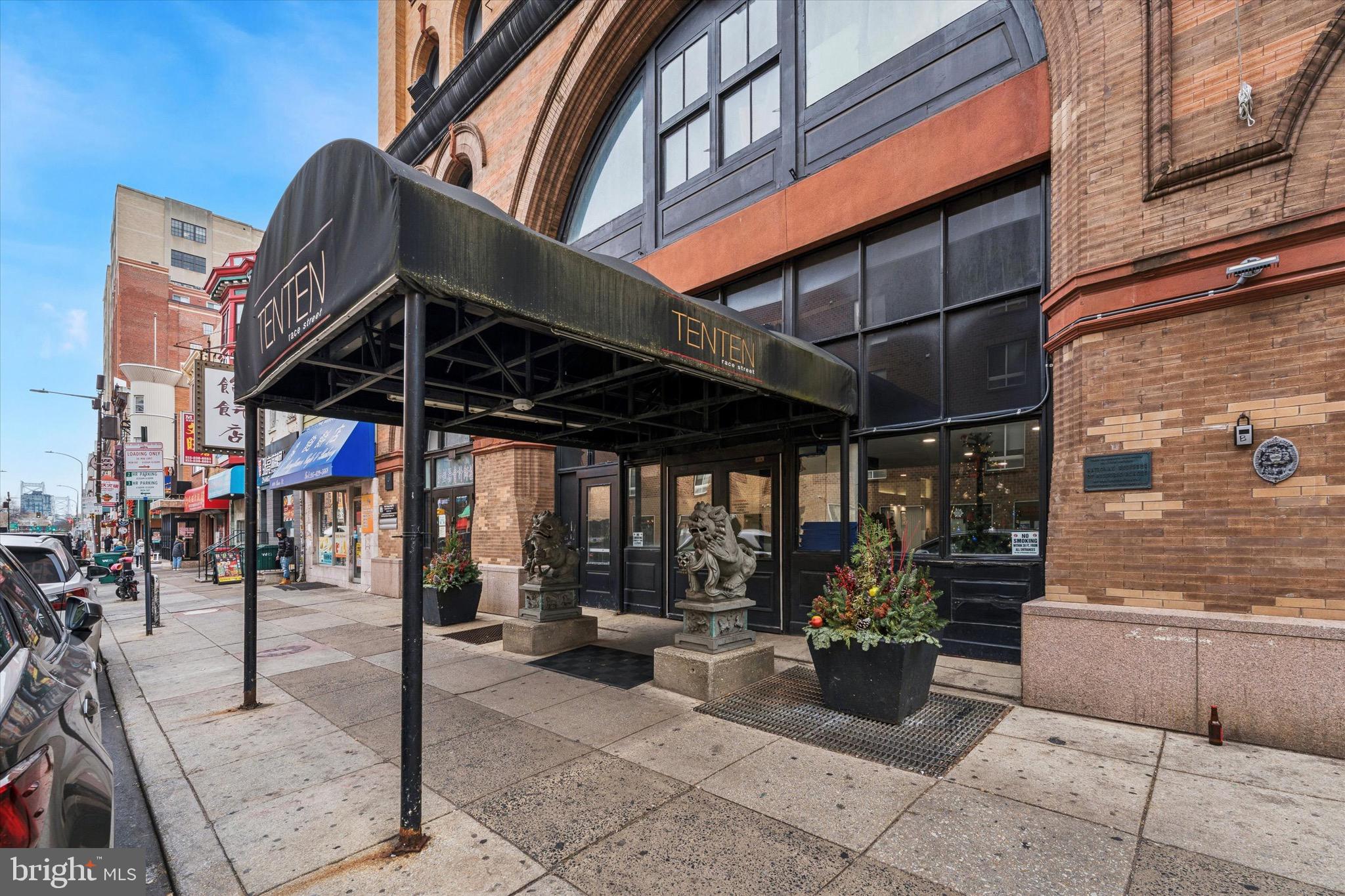 a view of path along with retail shop and buildings