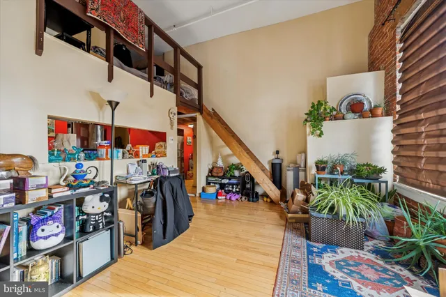 a view of entryway dining room and hall with wooden floor