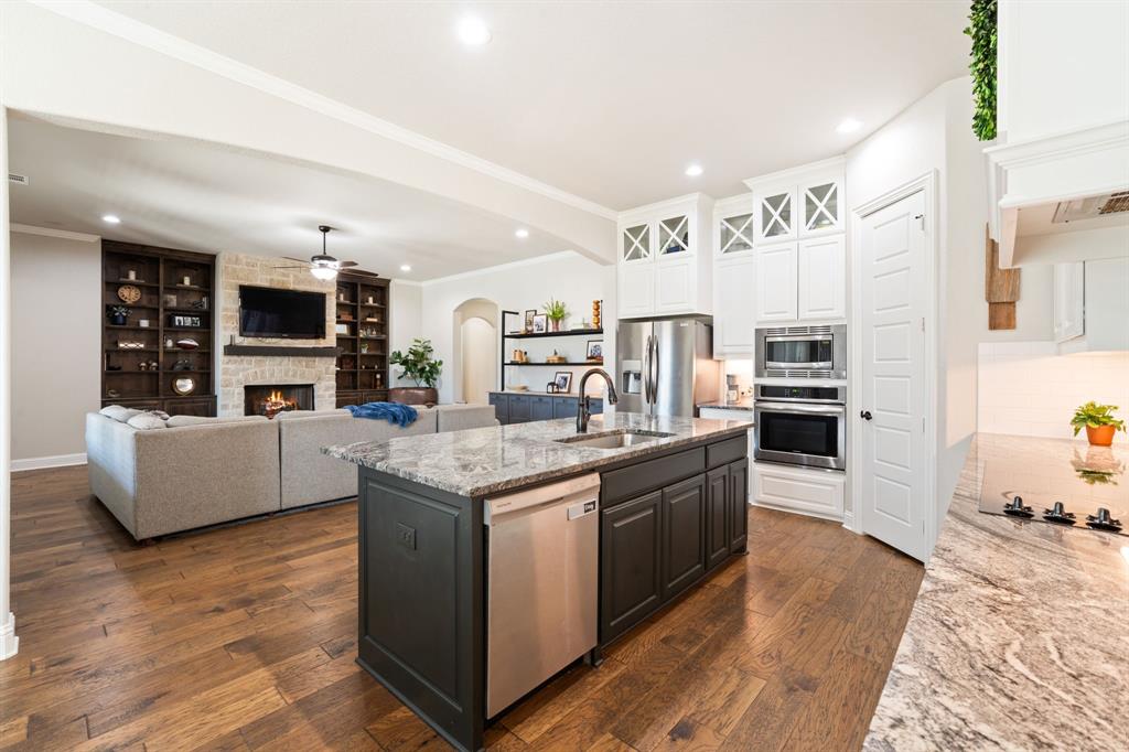 3601 Plainview Road Midlothian, TX 76065 - Photo 13 of 40 a kitchen with stainless steel appliances granite countertop a stove and a refrigerator