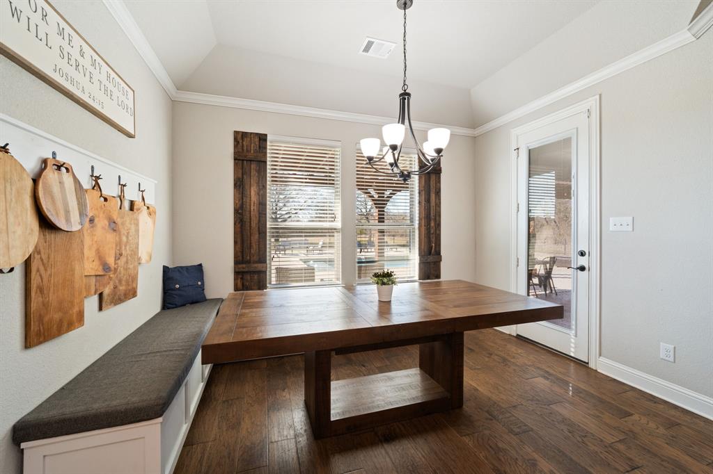 3601 Plainview Road Midlothian, TX 76065 - Photo 19 of 40 a view of a dining room with furniture wooden floor and chandelier