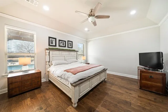 a bedroom with a bed and a table in it