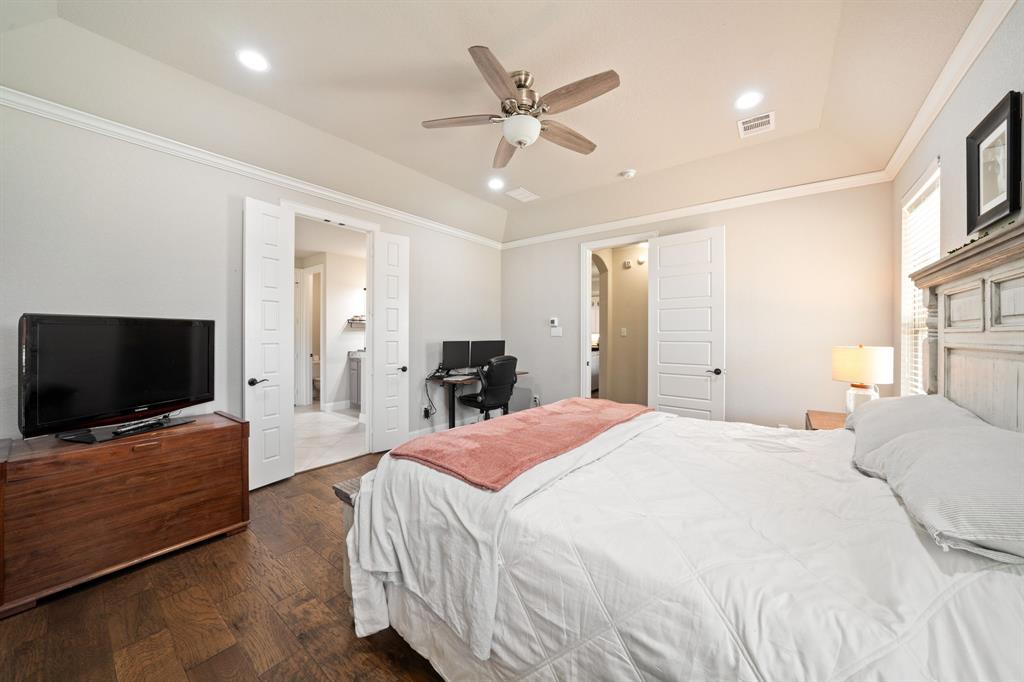 3601 Plainview Road Midlothian, TX 76065 - Photo 23 of 40 a bedroom with a bed and a flat screen tv