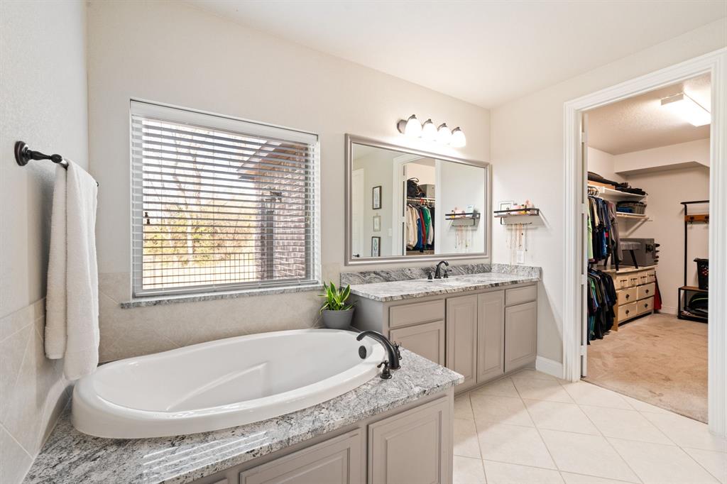 3601 Plainview Road Midlothian, TX 76065 - Photo 25 of 40 a spacious bathroom with a tub sink and mirror