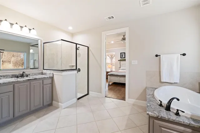 a bedroom with bed and a flat screen tv