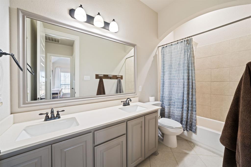 3601 Plainview Road Midlothian, TX 76065 - Photo 29 of 40 a bathroom with a double vanity sink toilet and mirror