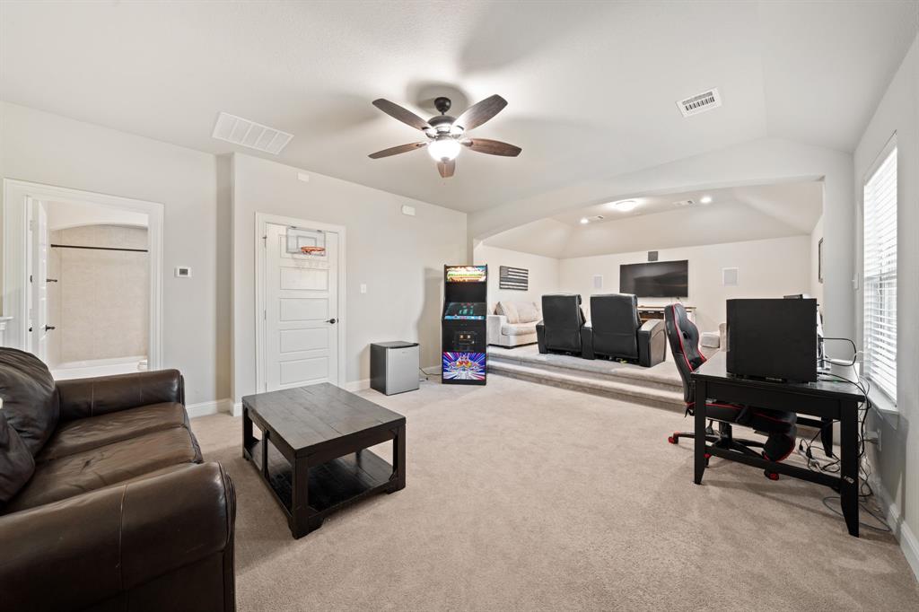 3601 Plainview Road Midlothian, TX 76065 - Photo 32 of 40 a living room with furniture and a flat screen tv