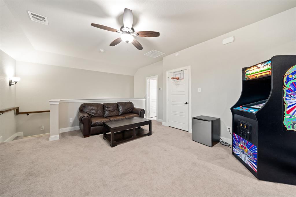 3601 Plainview Road Midlothian, TX 76065 - Photo 33 of 40 a living room with furniture and a flat screen tv